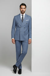 Man wearing light blue double-breasted suit with tailored fit, ideal for weddings and events.